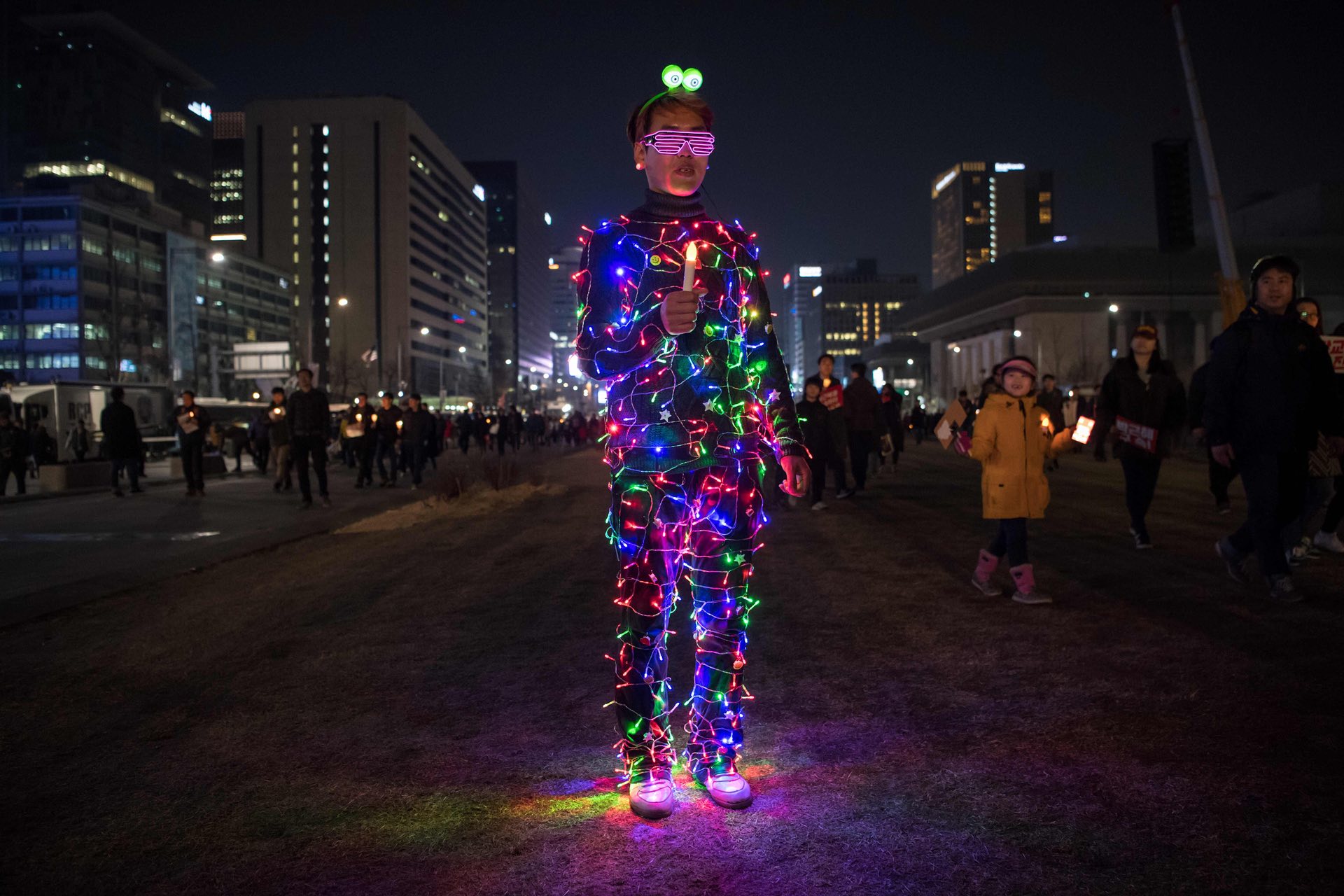 An anti-government protester wearing an illuminated costume takes part in a rally, Seoul, South Korea. PHOTO: AFP