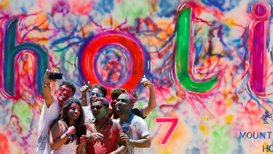 5.take selfies during Holi, the Festival of Colours organised by 