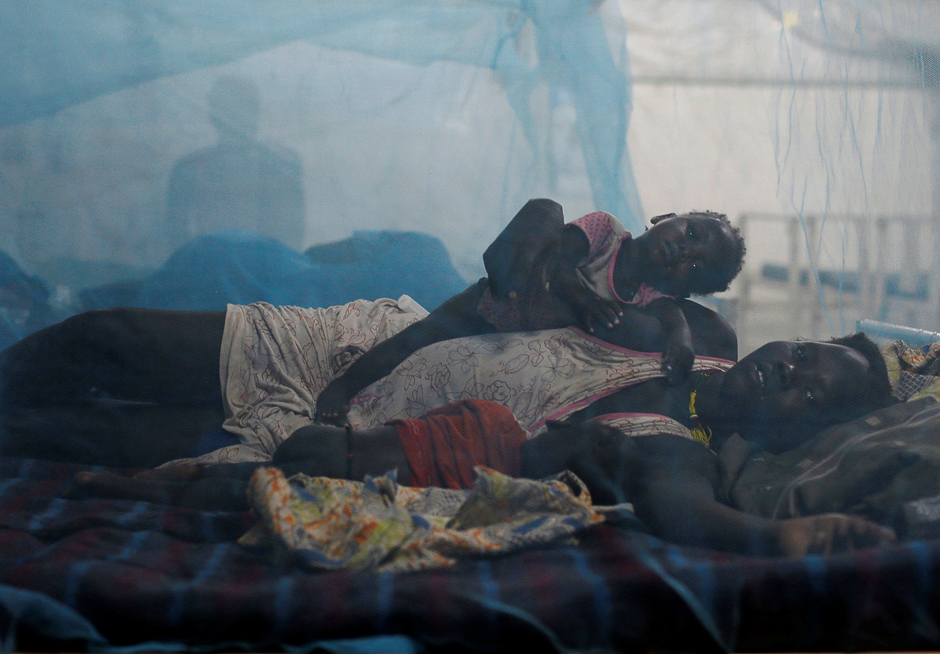A woman rests in bed with her children in the paediatric ward at the Medecins Sans Frontieres (MSF) hospital inside the United Nations Mission in South Sudan. PHOTO: REUTERS