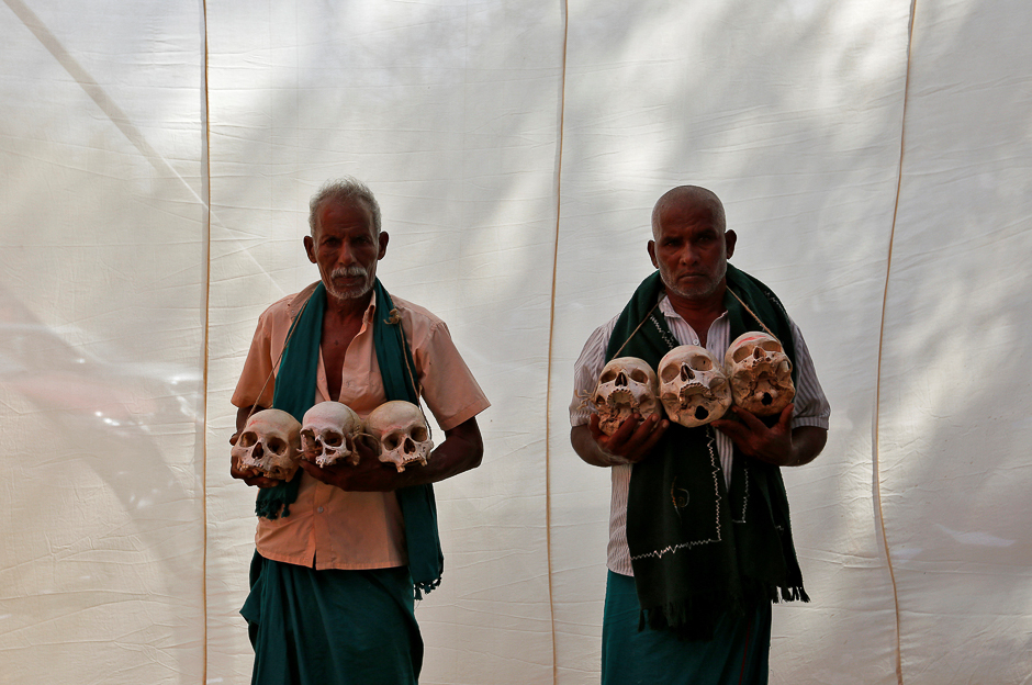 6.Farmers from the southern state of Tamil Nadu display skulls, who they claim are the remains of Tamil farmers who have committed suicide, during a protest demanding a drought-relief package from the federal government, in New Delhi, India. PHOTO: REUTERS