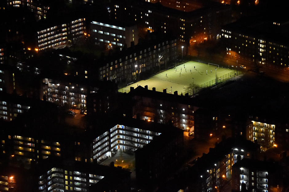 People play football at night in central London, United Kingdom. PHOTO: REUTERS