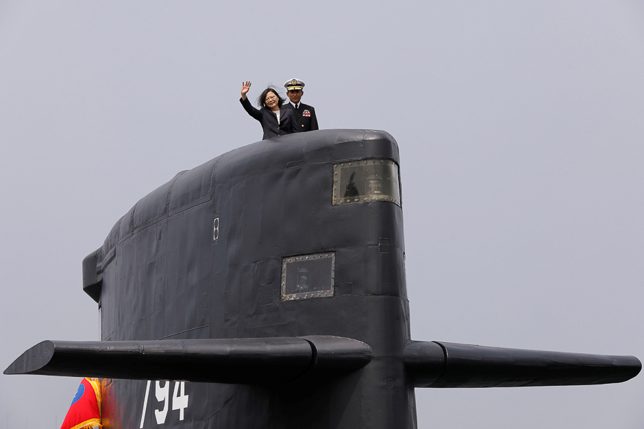 Taiwan President Tsai Ing-wen waves as she boards Hai Lung-class submarine (SS-794) during her visit to a navy base in Kaohsiung, Taiwan. PHOTO: REUTERS