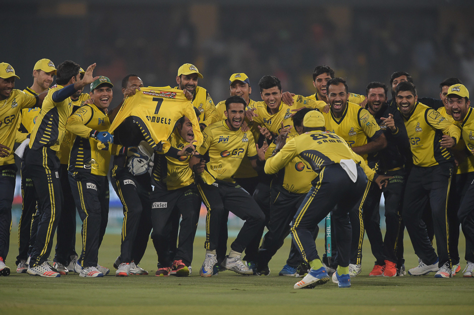 Cricketers of Peshawar Zalmi celebrate their victory over Quetta Gladiators. PHOTO: AFP