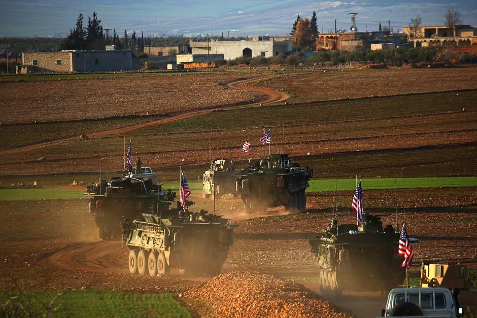 A convoy of US forces armoured vehicles drives near the village of Yalanli, on the western outskirts of the northern Syrian city of Manbij. PHOTO: AFP