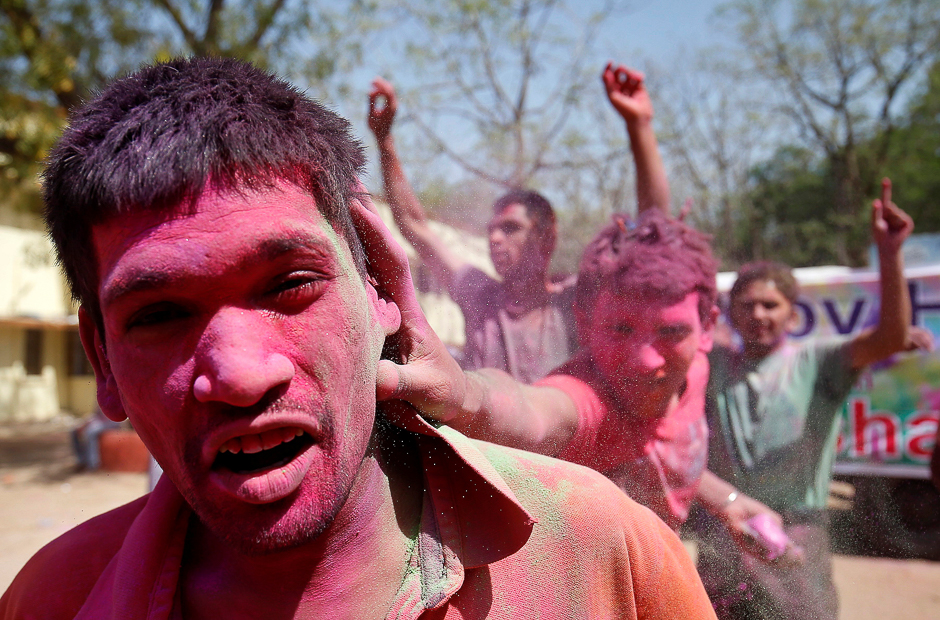 A boy reacts as he is smeared with colours, Ahmedabad, India. PHOTO: REUTERS