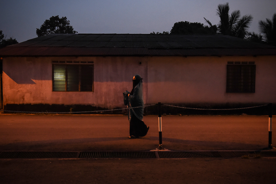 This picture shows a Malaysian woman walking to evening prayers at an Islamic centre in Kuala Lumpur. PHOTO: AFP 
