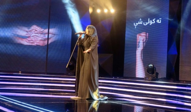 Afghan Star: Rap, stilettos and a musical revolution Aryana Sayeed, a judge of the television music competition 'Afghan Star', sings during the show in Kabul. PHOTO: AFP