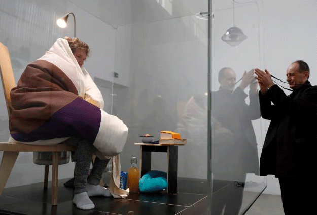 French artist Abraham Poincheval is seen in a vivarium on the first day of his performance in an attempt to incubate chicken eggs, which takes from 21 to 26 days, at the Palais de Tokyo Museum in Paris, France, March 29, 2017. PHOTO: REUTERS