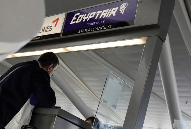 A traveller speaks to an agent at an Egypt Air counter at JFK International Airport in New York, US, March 21, 2017. PHOTO: REUTERS