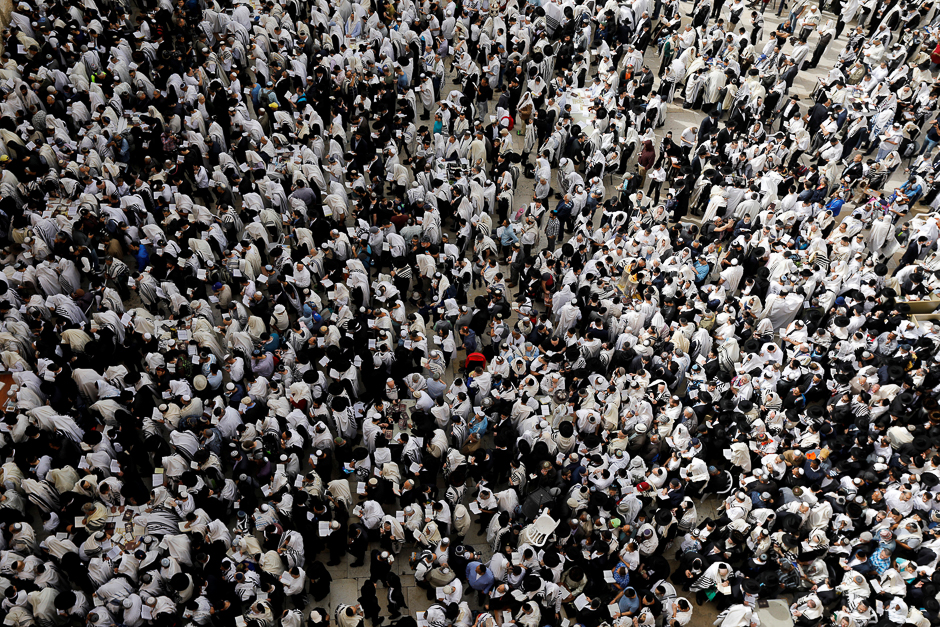 Jewish worshippers are seen from above during the priestly blessing prayer on the holiday of Passover, at the Western Wall in Jerusalem's Old City. PHOTO: REUTERS