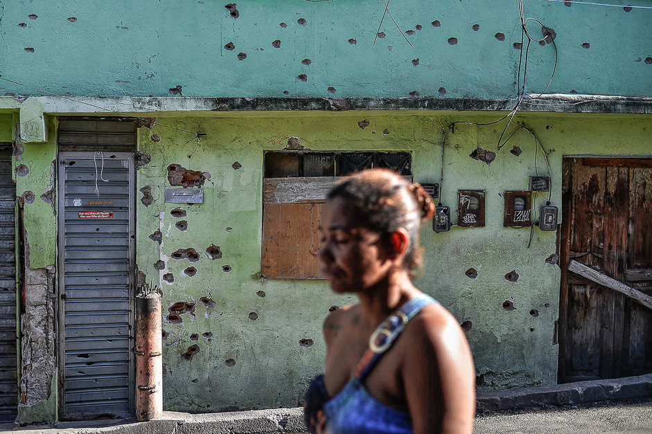 Bullet holes are seen on a wall of the house outside of which 13-year-old Henrique de Oliveira was shot dead during an anti-drug police operation in the Complexo do Alemao favela or shantytown in Rio de Janeiro, Brazil. PHOTO: AFP