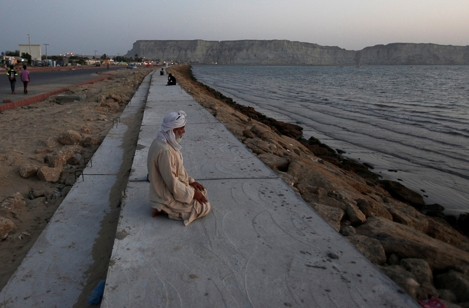 11.prayers on a newly constructed pavement along the beach in Gwadar. PHOTO: REUTERS