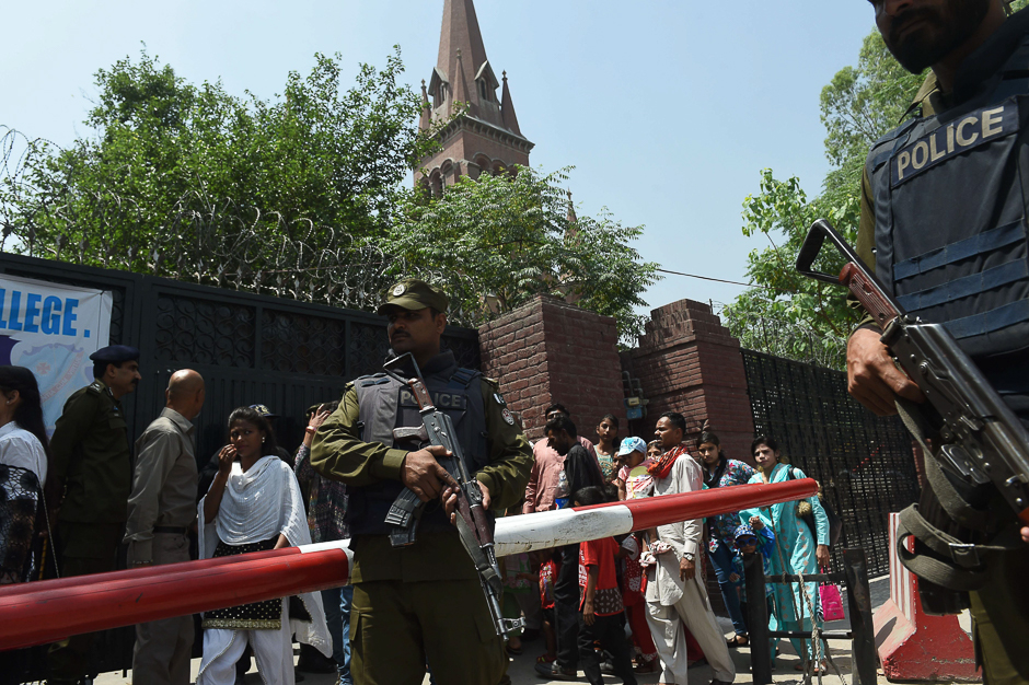A Pakistani policeman stands guard during the Easter Sunday service at the Sacred Heart Cathedral Church in Lahore. PHOTO: AFP