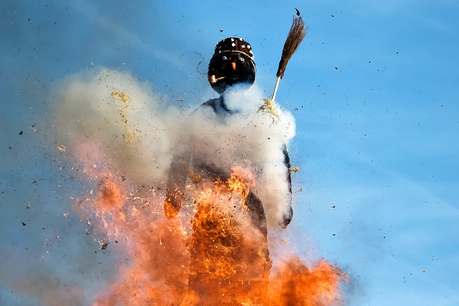 The Boeoegg, a giant symbolic snowman made of wadding and and filled with firecrackers burns on top of a bonfire in Sechselaeuten square in Zurich. PHOTO: AFP