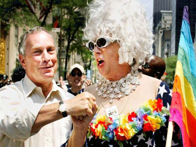 New York Mayor Michael Bloomberg greets Gilbert Baker as they take partial in a annual Gay Pride march in New York City, Jun 30, 2002. PHOTO: REUTERS
