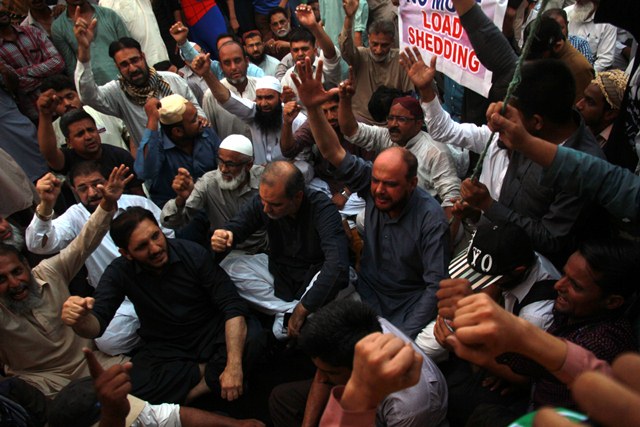 ji leader hafiz naeem along with workers siting in a dharna at governor house photo athar khan