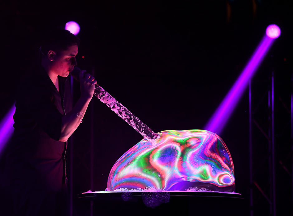 Bubble artist Deni Yang performs his act during his Mega Bubblefest Laser Show at the Discovery Cube Science Centre in Santa Ana, California. PHOTO: AFP
