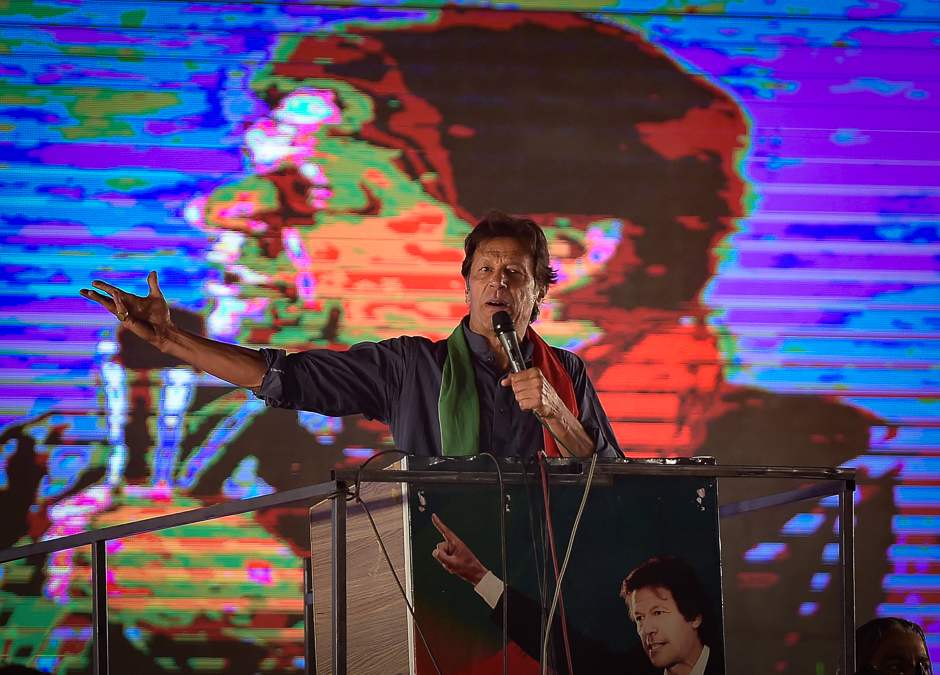 Pakistani cricketer-turned-opposition leader and head of the Pakistan Tehreek-i-Insaf (PTI) Imran Khan speaks to his supporters during an anti-governement rally in Islamabad. PHOTO: AFP