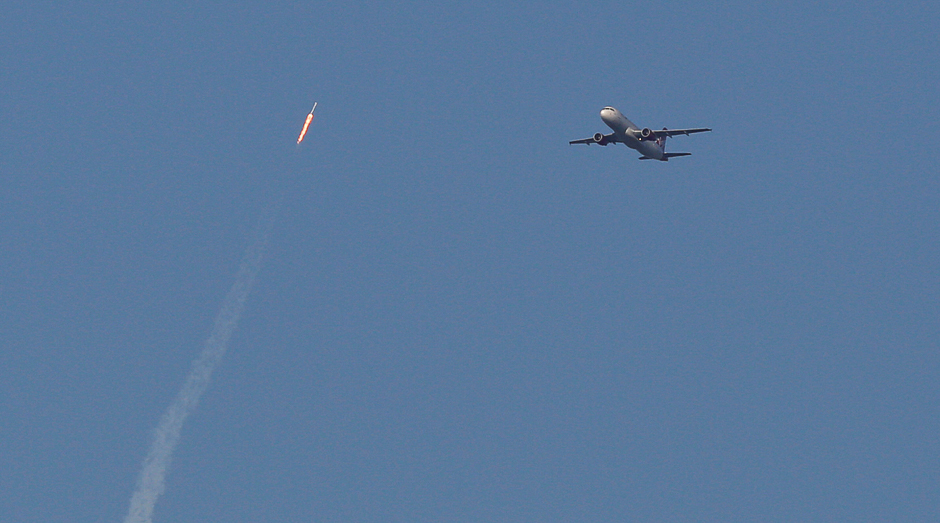 A recycled SpaceX Falcon 9 rocket soars toward space above a Virgin Airlines passenger jet, which had just departed Orlando International Airport, in Orlando, Florida. PHOTO: REUTERS