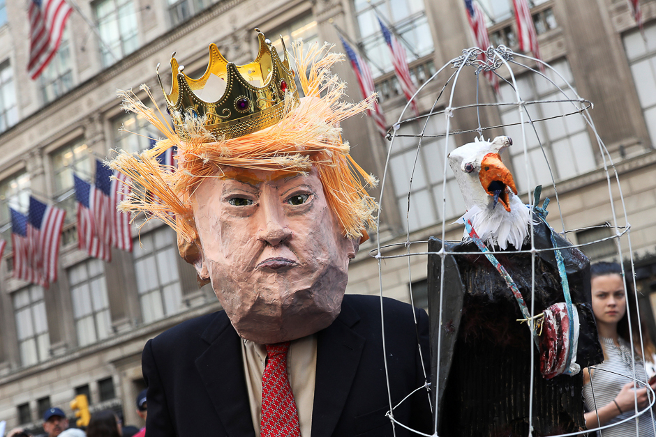 A man wears a of mask of US President Donald Trump during the annual Easter Parade and Bonnet Festival along 5th avenue in New York, US. PHOTO: REUTERS