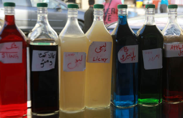 Different flavoured syrups are used to make gola ganda and some vendors claim to make them at home. PHOTO: ATHAR KHAN/EXPRESS