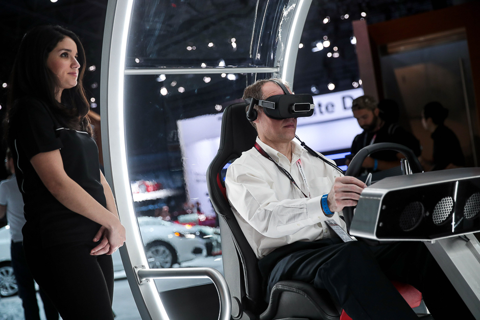 A man tries driving in the Acura virtual driving experience. PHOTO: AFP