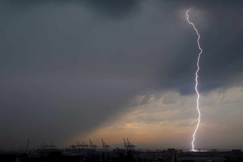 A bolt of lightning strikes over harbour cranes in Cape Town, South Africa. PHOTO: REUTERS