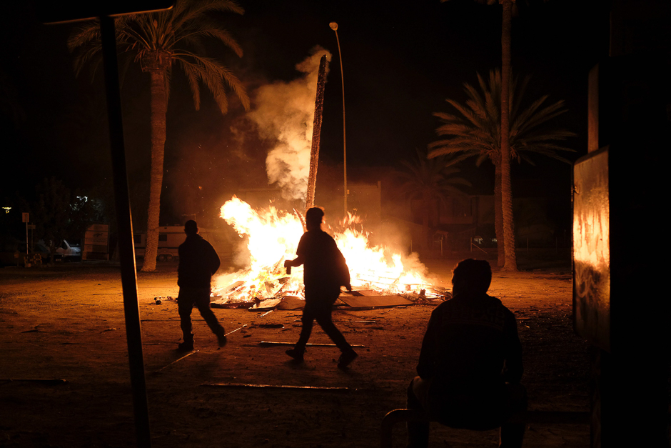 Cypriot youths watch a bonfire where an effigy of Judas Iscariot was burned, on Easter Saturday after midnight in the old city of the capital Nicosia. PHOTO: AFP