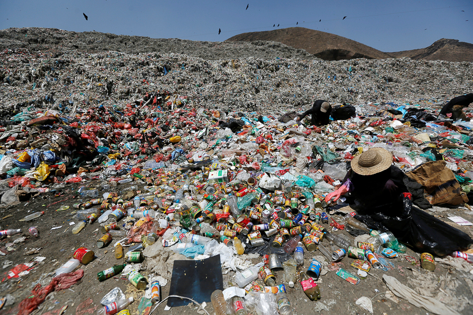 A woman collects recyclable items from at a rubbish landfill site on the outskirts of Sanaa, Yemen. PHOTO: REUTERS