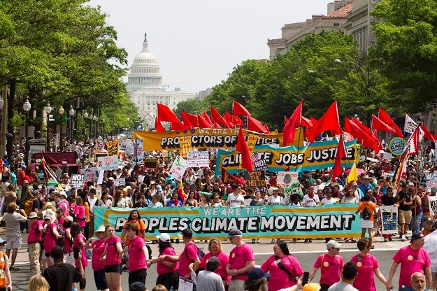 Demonstrators march on Pennsylvania Avenue during the People's Climate March in Washington DC, on April, 29, 2017. PHOTO: AFP
