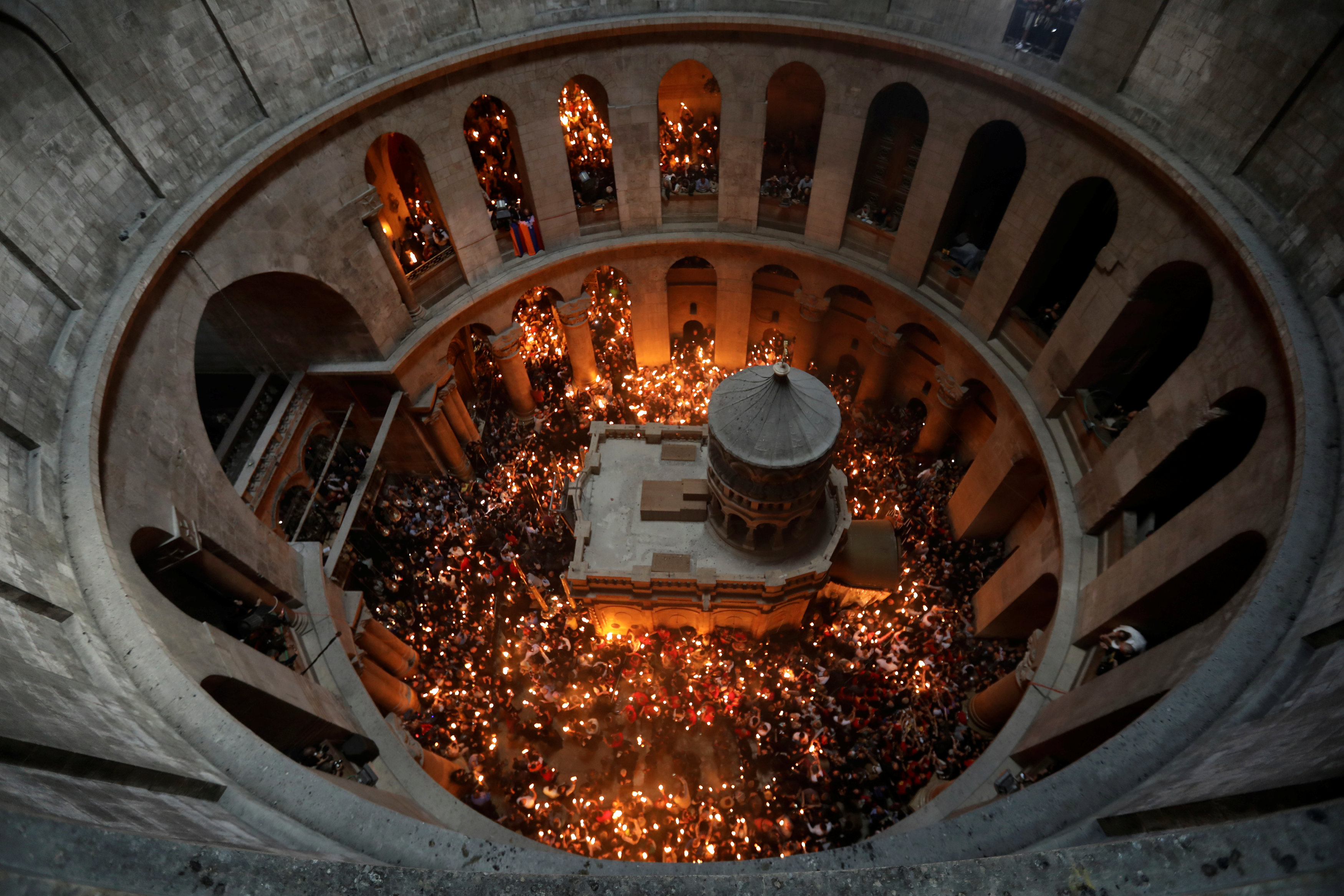 Worshippers hold candles as they take part in the Christian Orthodox Holy Fire ceremony at the Church of the Holy Sepulchre in Jerusalem's Old City. PHOTO: REUTERS