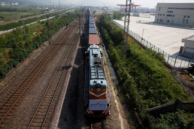  A train carrying containers from London arrives at the freight railway station in Yiwu, Zhejiang province, China, April 29, 2017. The sign at the front of the train reads: 