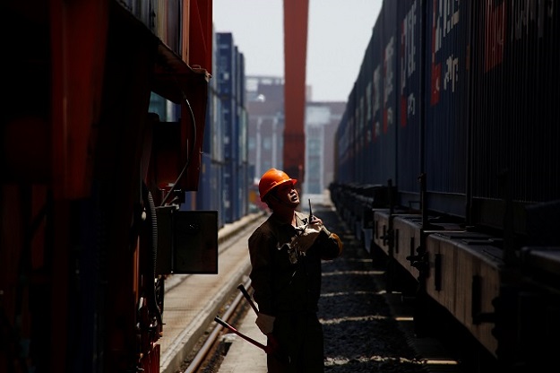  A train carrying containers from London arrives at the freight railway station in Yiwu, Zhejiang province, China, April 29, 2017. The sign at the front of the train reads: 