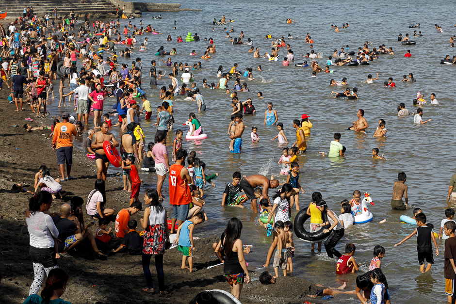 People frolic at the beach to celebrate Easter Sunday, Tanza, Philippines. PHOTO: REUTERS