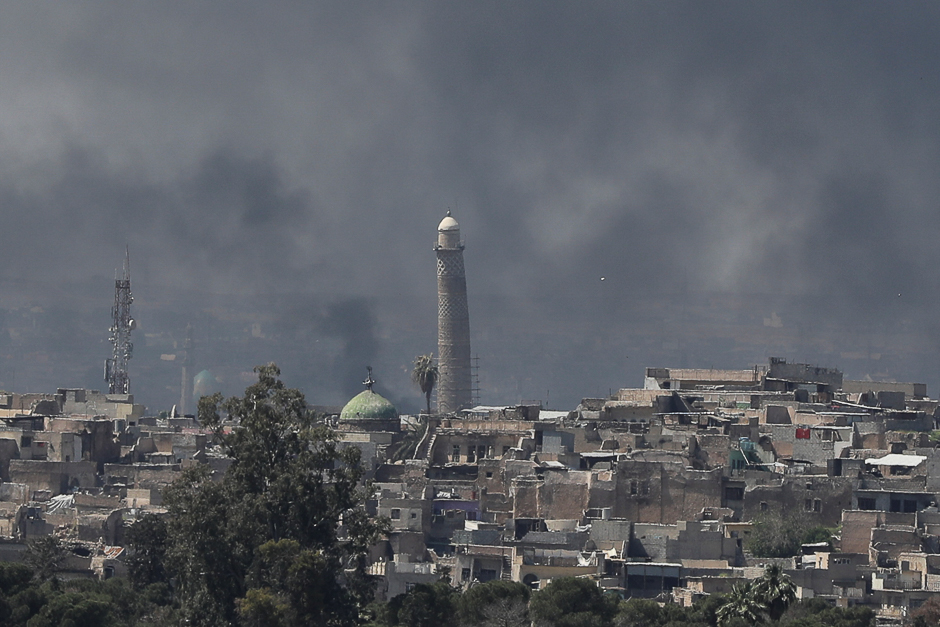 A smoke rises above Al-Nuri mosque in the old city as Iraqi forces fight Islamic State militants in Mosul, Iraq. PHOTO: REUTERS