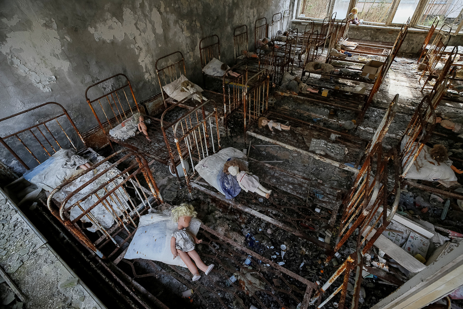 Dolls, which were placed by a visitor, lie at beds at a kindergarten in the abandoned city of Pripyat near the Chernobyl nuclear power plant in Ukraine. PHOTO: REUTERS