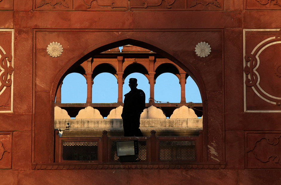 A soldier stands guard during evening prayers led by Sheikh Saleh bin Ibrahim Imam Qaba at the Badshahi Mosque in Lahore. PHOTO: REUTERS
