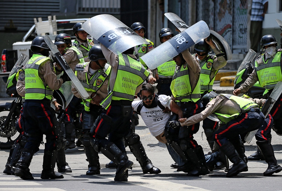 A demonstrator is arrested by riot police while rallying against Venezuela's President Nicolas Maduro's government in Caracas, Venezuela. PHOTO: REUTERS