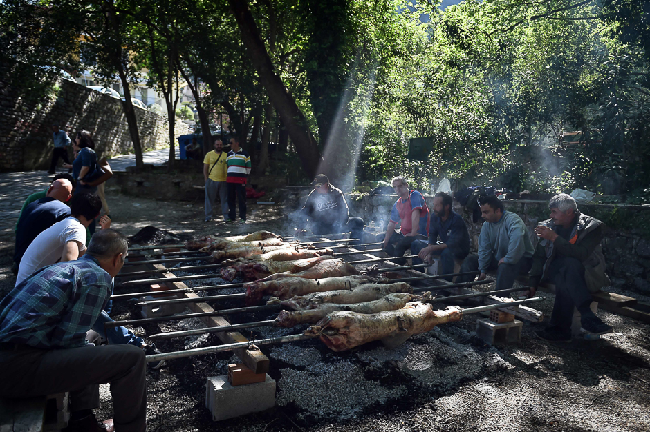 Locals people grill lambs in the town of Livadia, north of Athens, during a traditional celebrations of the Orthodox Easter. PHOTO: AFP