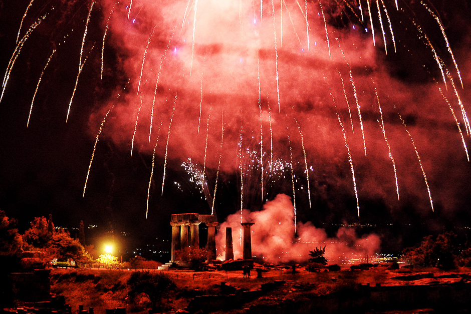 Fireworks explode over the Temple of Appolon in the villge of Ancient Corinth during the traditional celebrations of the Orthodox Easter. PHOTO: AFP
