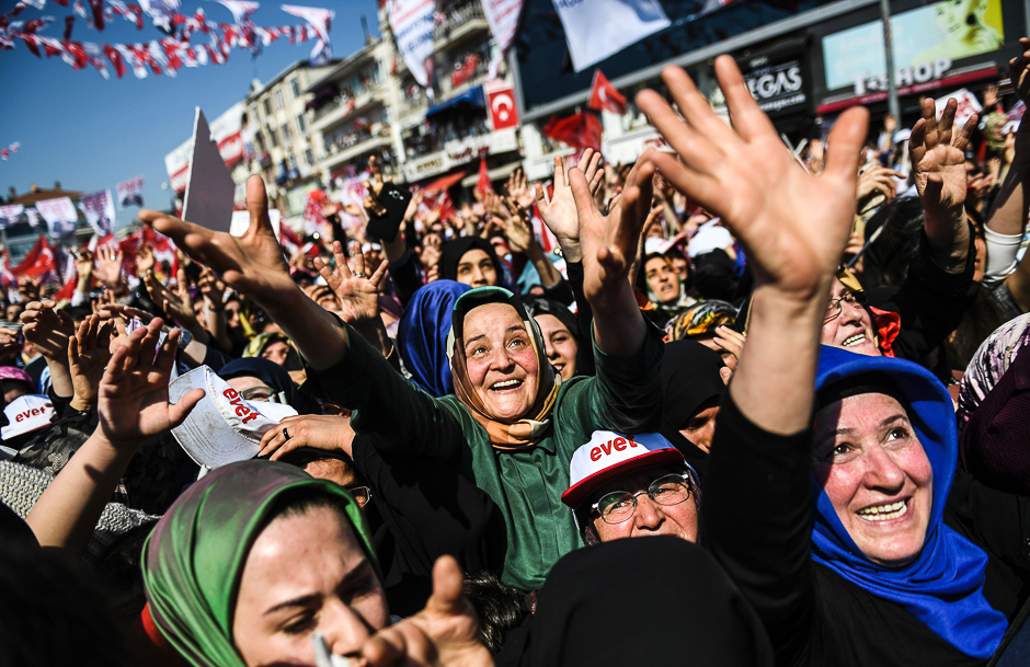 People cheers as the Turkish president delivers a speech in Istanbul. PHOTO: AFP