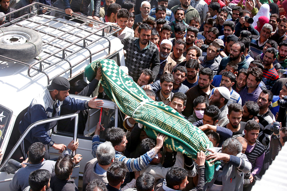 People carry the body of Ali Mohammed Dagga, a driver who according to local media reports died after he was hit by a stone while driving his vehicle during clashes between Kashmir demonstrators and Indian police on Monday evening during a protest against recent civilian killings, for his funeral in Srinagar, India. PHOTO: REUTERS