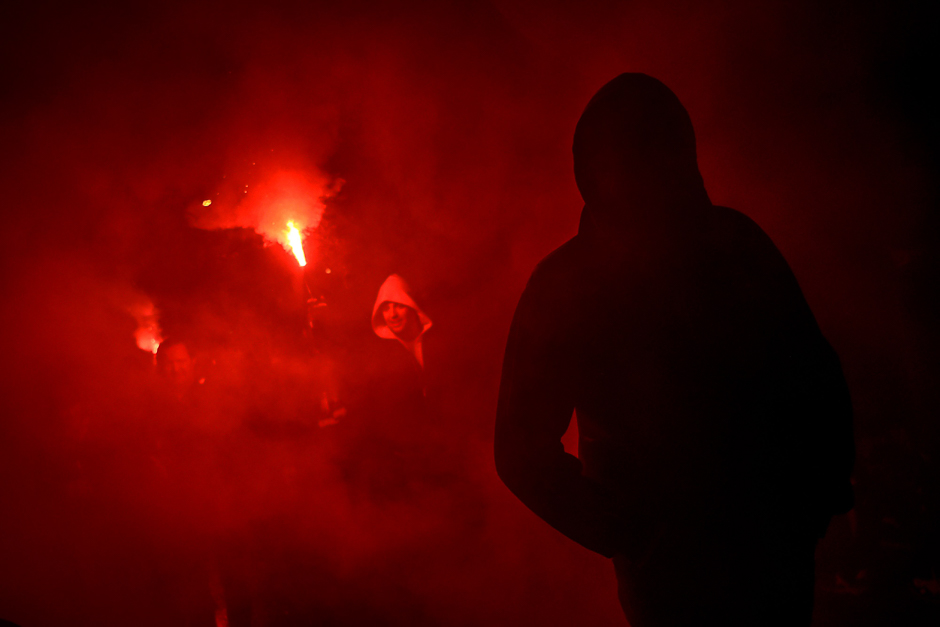 Besiktas' supporters light flares before the UEFA Europa League second leg quarter final football match between Besiktas and Lyon (OL) near the Vodafone arena stadium in Istanbul. PHOTO: AFP