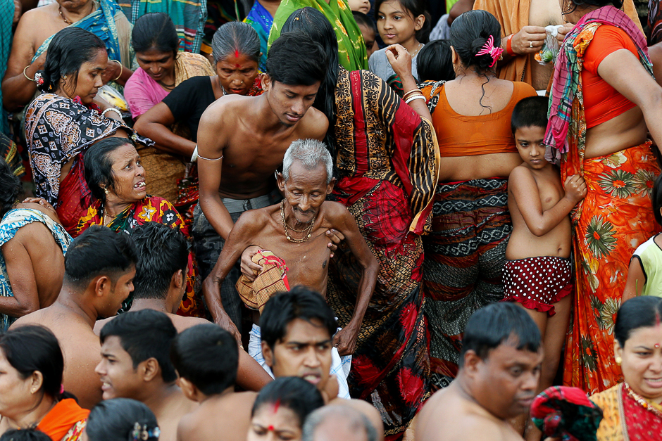 Hindu devotees gather to bathe in the Brahmaputra River aspart of a ritual to observe the Astami Tithi at Langalband, Narayanganj near Dhaka, Bangladesh. PHOTO: REUTERS