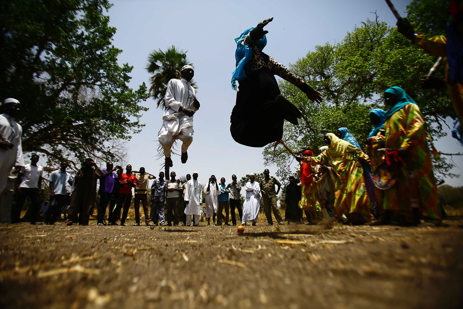 Sudanese people dance at the Um Bager market near the Dinder national reserve, a protected region 480 kilometres from the capital Khartoum, in Sudan's southern Sennar state. PHOTO: AFP