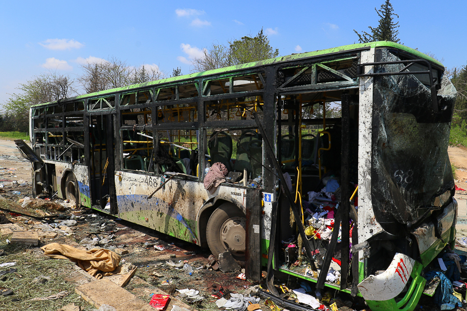 A damaged bus is seen after an explosion yesterday at insurgent-held al-Rashideen, Aleppo province, Syria. PHOTO: REUTERS