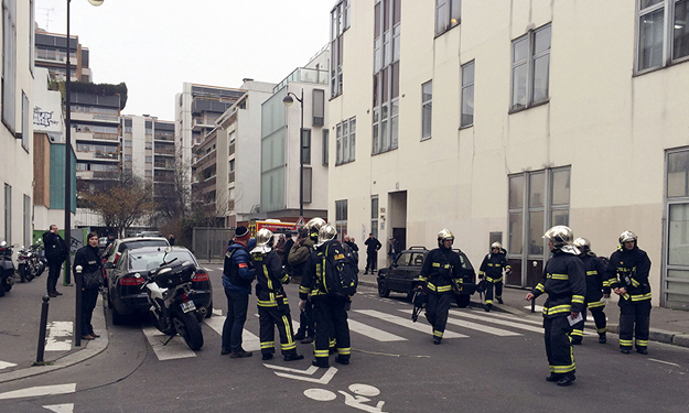 Two men armed with Kalashnikov rifles storm the Paris offices of satirical weekly Charlie Hebdo killing 12 people in January, 2015. PHOTO: AFP