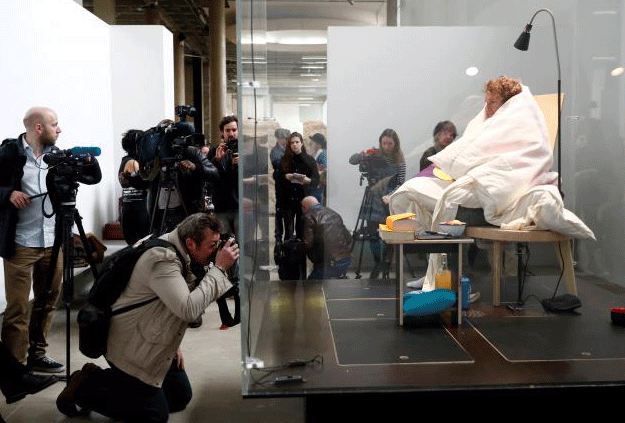 French artist Abraham Poincheval is seen in a vivarium on the first day of his performance in an attempt to incubate chicken eggs, which takes from 21 to 26 days, at the Palais de Tokyo Museum in Paris, France, March 29, 2017. PHOTO: REUTERS