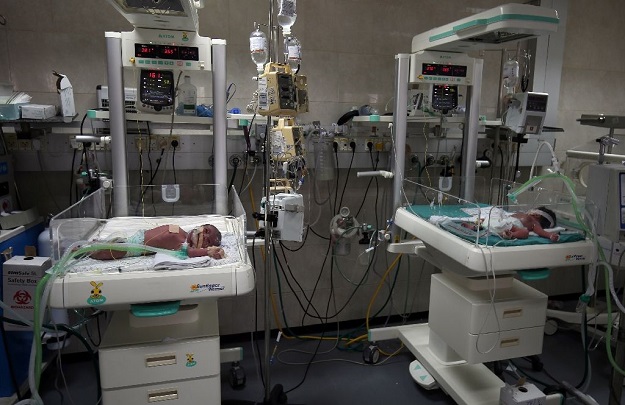 Newborns are seen inside incubators in the neonatal intensive care unit at the Al-Shifa hospital, which relies heavily on generators due to drastic power cuts in Gaza City. PHOTO: AFP