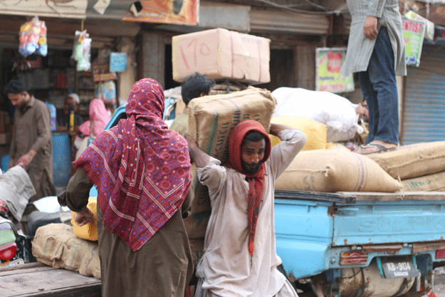Forced to cope with the ever increasing inflation and afraid of dying in abject poverty, a myriad of these unsung heroes whose shoulders carry the burden of the metropolisâ economy cannot take a day off on Labour Day. PHOTO: FAWAD HASAN